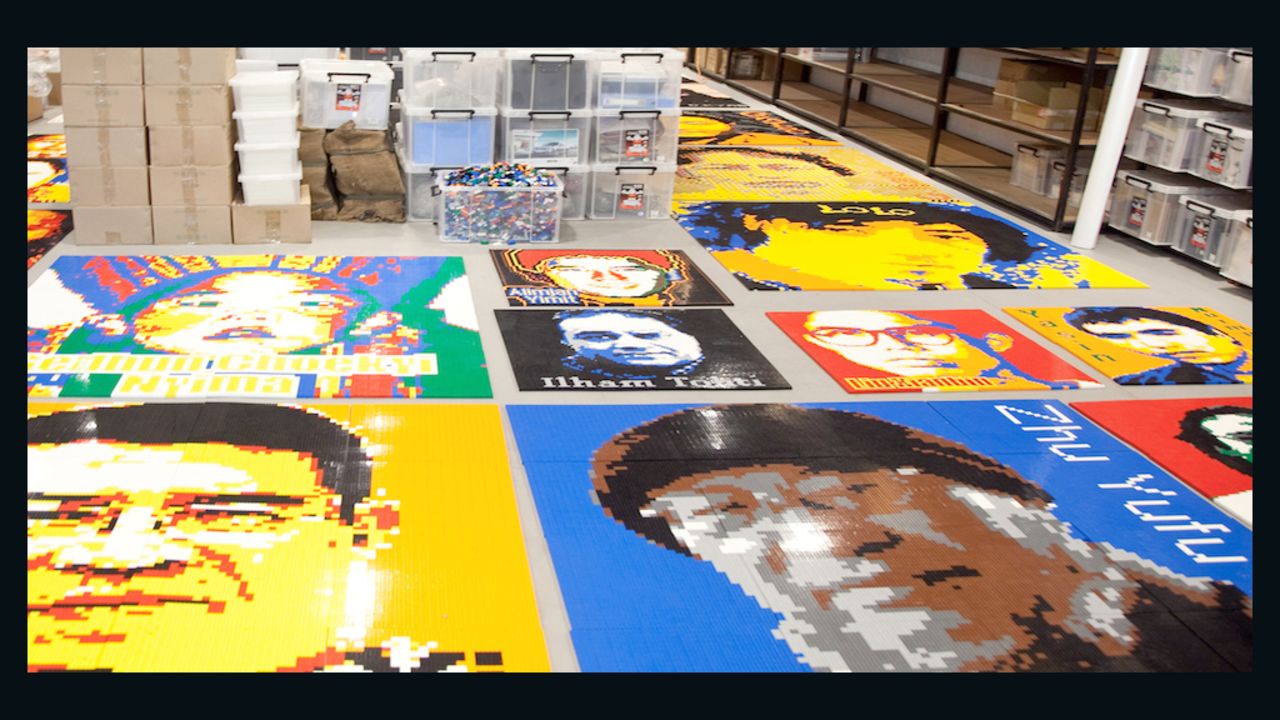Sections of Lego portraits of imprisoned dissidents are laid out in Ai Weiwei's Beijing studio in June 2014.