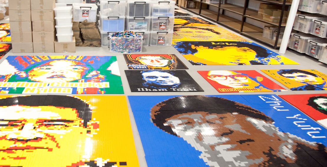 Sections of Lego portraits of imprisoned dissidents are laid out in Ai Weiwei's Beijing studio in June 2014.