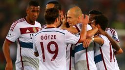 Bayern's Arjen Robben is mobbed by his teammates after scori9ng the opening goal against AS Roma in the Italian capital.