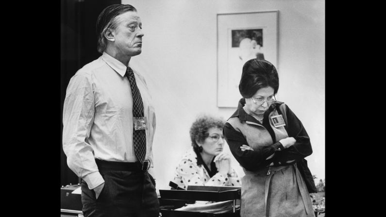Bradlee and Deputy Editorial Page Editor Meg Greenfield, right, listen with another staff member to a statement being read by Post Publisher Katharine Graham during the 1975 press strike at the newspaper.