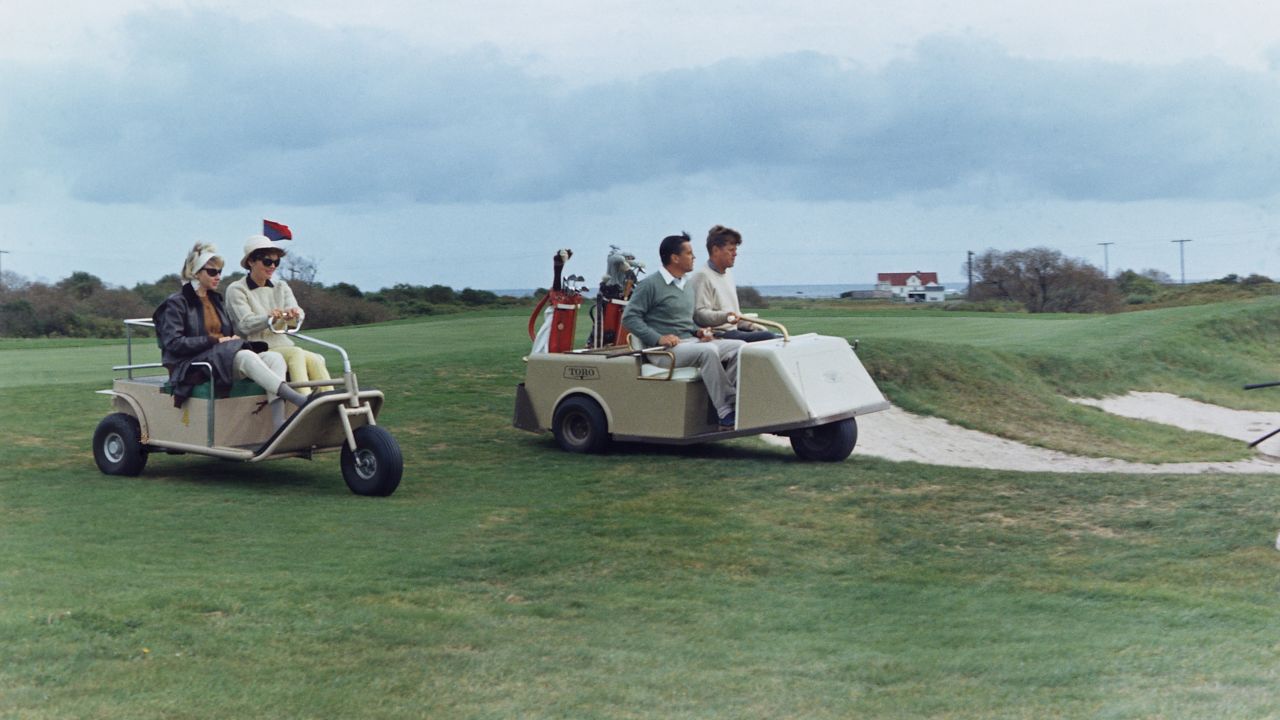 In September 1963 -- some two months before he was assassinated -- President John F. Kennedy played golf with Bradlee at Newport Country Club in Rhode Island. Accompanying them are first lady Jacqueline Kennedy and Antoinette Bradlee, his second wife.<br />
