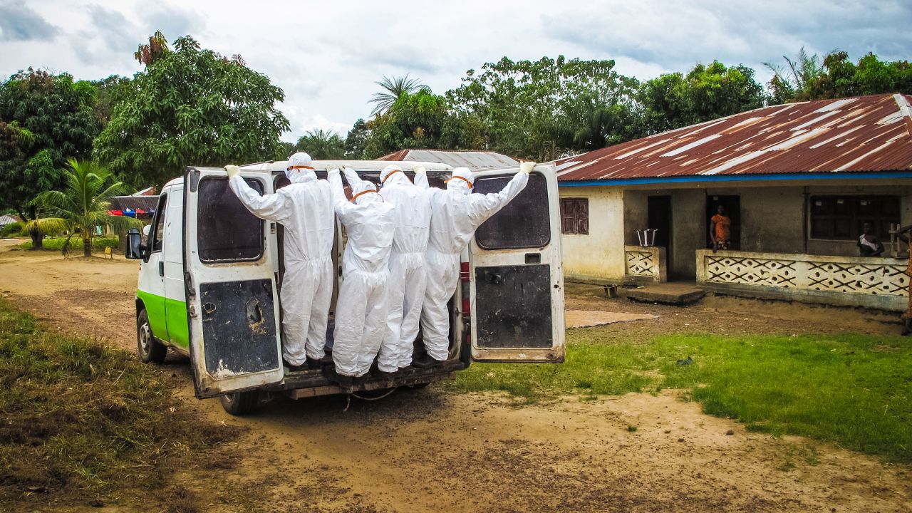 Health workers in Port Loko, Sierra Leone, transport the body of a person who is suspected to have died of Ebola on October 21, 2014.