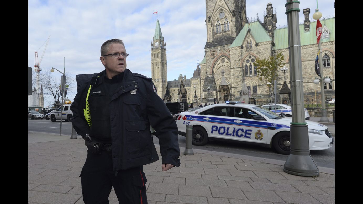 A police officer secures the scene on Parliament Hill.