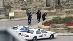 Police teams enter Centre Block at Parliament Hill in Ottawa on  Wednesday Oct. 22, 2014.  A soldier standing guard at the National War Memorial was shot by an unknown gunman and people reported hearing gunfire inside the halls of Parliament. Prime Minister Stephen Harper was rushed away from Parliament Hill to an undisclosed location, according to officials. (AP Photo/The Canadian Press, Justin Tang/The Canadian Press/AP)