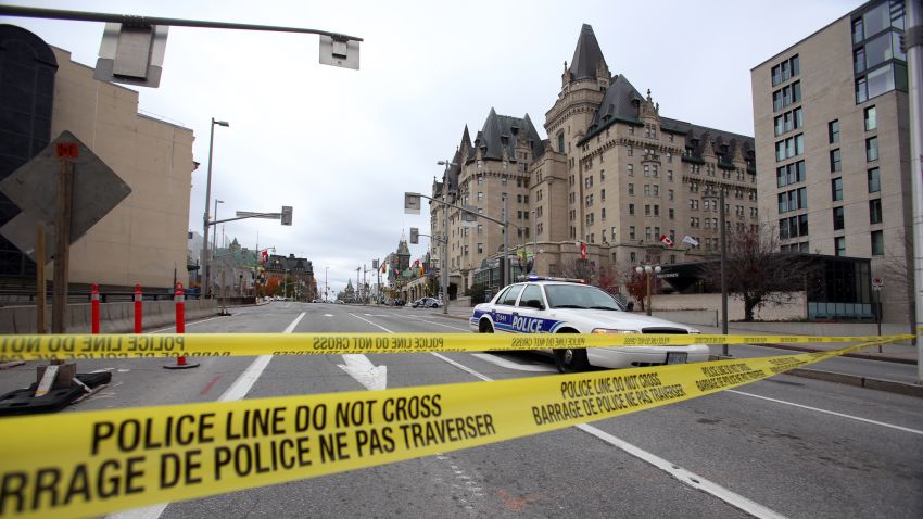 Caption:OTTAWA, CANADA - OCTOBER 22: Police tape blocks Wellington St. at Sussex near the National War Memorial where a soldier was shot earlier in the day, just blocks away from Parliament Hill, on October 22, 2014 in Ottawa, Canada. Officials are investigating multiple reports of shootings and suspects after at least one gunman shot a Canadian soldier and then entered Canada's Parliament building. (Photo by Mike Carroccetto/Getty Images)