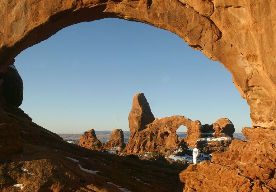 The red coloring in the arches at the namesake Arches National Park comes from sandstone with iron oxide.