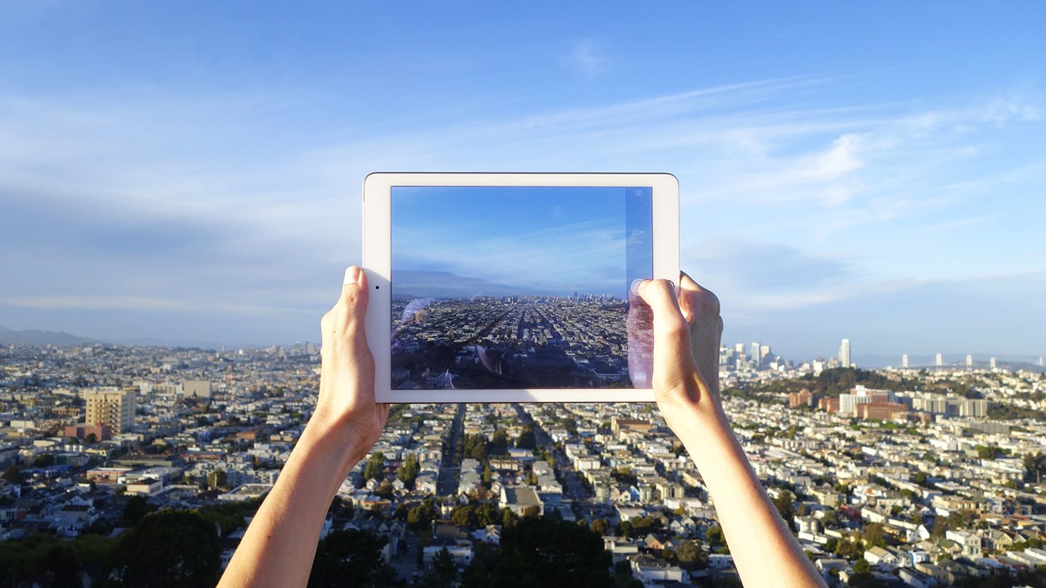 An  Apple iPad Air 2 user takes a photo of San Francisco from Bernal Heights. 