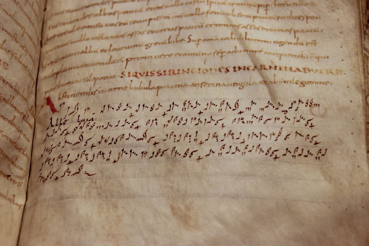 This theological book has had musical notes from a hymn drawn into it by a reader, for his own amusement. It is one of the earliest examples of musical notation in existence.