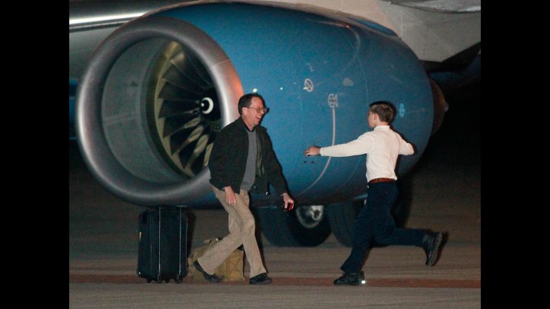 Jeffrey Edward Fowle is greeted by his son Wednesday, October 22, after arriving at Wright-Patterson Air Force Base in Ohio. Fowle had been detained in North Korea for months after he was accused of leaving a Bible in a restaurant. <a href="http://www.cnn.com/2013/05/02/world/gallery/americans-detained/index.html">See other Americans who have been detained abroad</a>