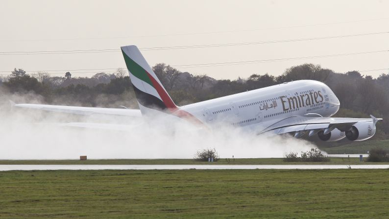 A plane lands at the airport in Manchester, England, on Tuesday, October 21. Heavy winds from Hurricane Gonzalo made landing tricky for some flights in the region.