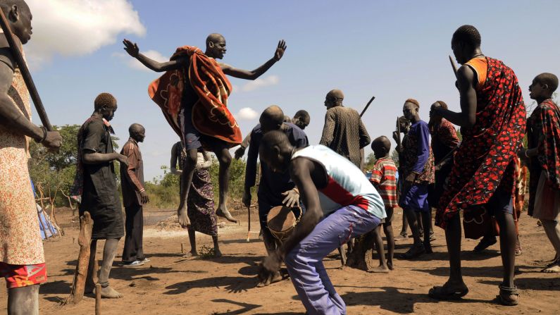 Cattle keepers from the Dinka tribe perform a traditional dance Saturday, October 18, after a prayer session outside Juba, South Sudan.