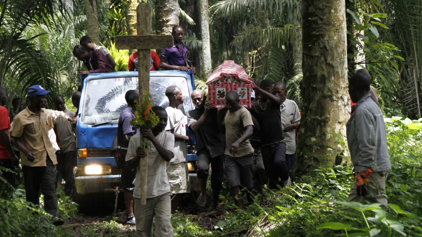 The body of Yvonne Masika is carried by relatives and friends Tuesday, October 21, in the Mbau village in the Democratic Republic of Congo. Masika was killed during an attack by suspected Ugandan rebels.