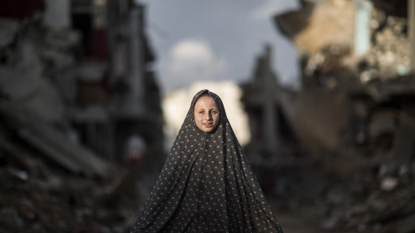 A Palestinian girl stands near rubble that used to be houses in the Al-Shejaiya neighborhood east of Gaza City on Sunday, October 19. The buildings were destroyed during the 50-day conflict between Israel and Hamas earlier this year. <a href="http://www.cnn.com/2014/10/17/world/gallery/week-in-photos-1017/index.html">See last week in 30 photos</a>