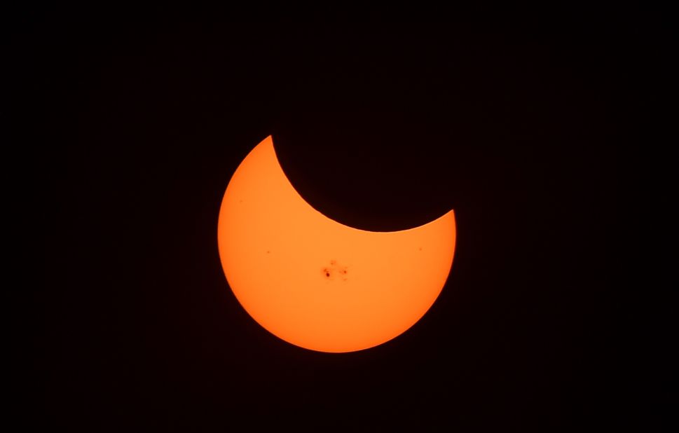 Sunspots are seen during the peak moment of the solar eclipse when the moon was covering 34% of the sun.