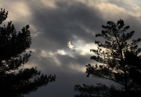 While photographing his son's high school soccer match, <a href="http://ireport.cnn.com/docs/DOC-1182674">Doug Mackenzie</a> noticed the partial solar eclipse during a break in the clouds over Independence, Missouri.