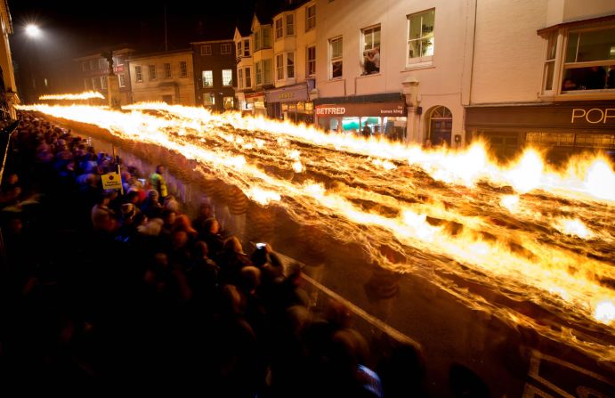 So-called "bonfire societies" parade through the streets of Lewes, holding aloft burning crosses. The event annually attracts crowds of thousands.