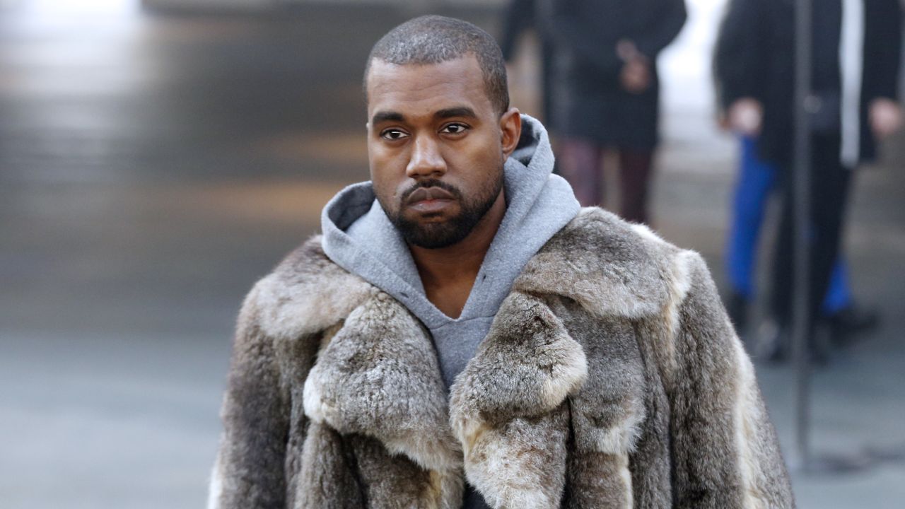US musician Kanye West arrives to attend Givenchy's Fall/Winter 2014-2015 men's fashion show in Paris on January 17, 2014.   AFP PHOTO FRANCOIS GUILLOT        (Photo credit should read FRANCOIS GUILLOT/AFP/Getty Images)