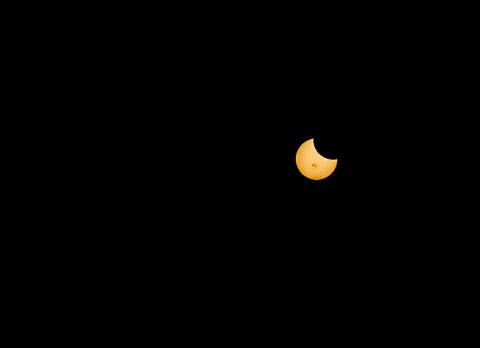 <a href="http://ireport.cnn.com/docs/DOC-1182587">Small, black sunspots</a> were visible during Thursday's partial solar eclipse. Ryan Gronquist captured this crisp shot from downtown Austin, Texas.