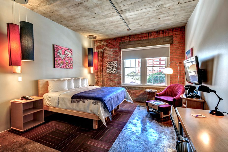 The NYLO Dallas South Side hotel is located in a former Sears warehouse dating to 1911. All loft-style guestrooms have details such as exposed brick walls, high ceilings and concrete floors.