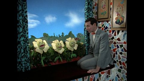 Pee-wee and the window box flowers have a heart-to-heart-to-heart-to-heart.