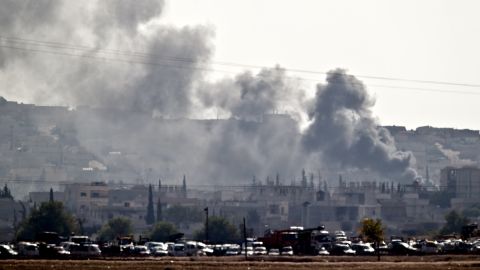 Smoke rises during fighting in Kobani, seen from the outskirts of Suruc, near the Turkey-Syria border, Saturday, October 25. 