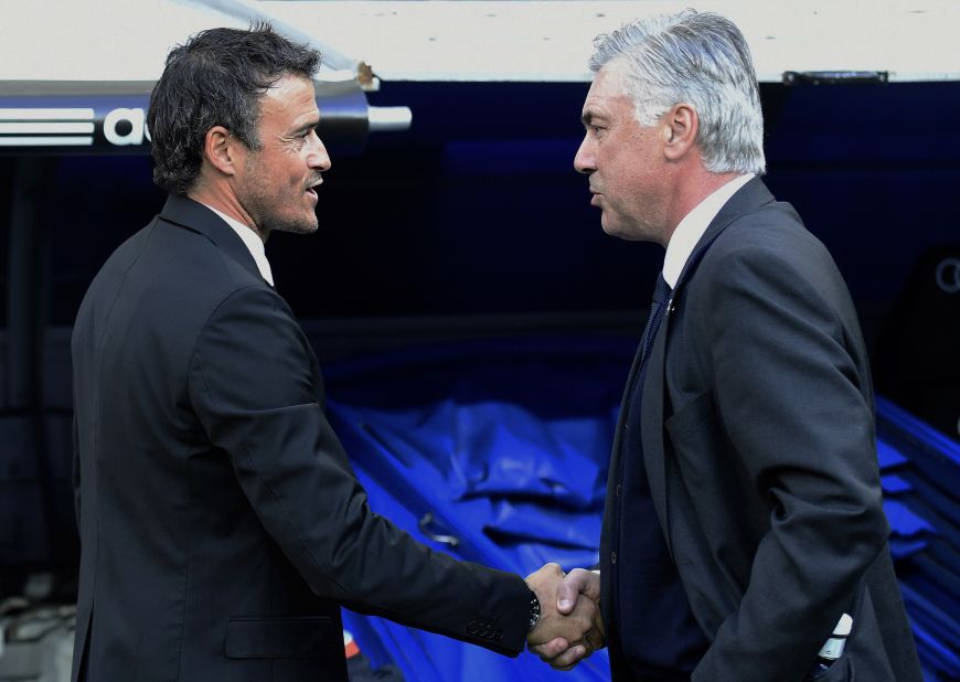 Barcelona coach Luis Enrique (left) talks with Real Madrid's Italian coach Carlo Ancelotti before the match.