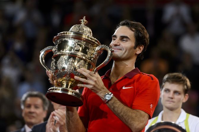 Federer lifts the trophy in Basel for the sixth time after beating David Goffin in the final. It was his fifth title of 2014.