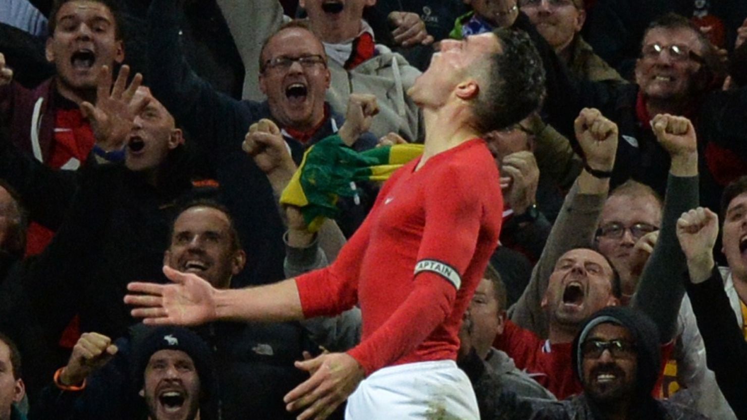 Robin van Persie celebrates his late equalizer at Old Trafford against Chelsea.