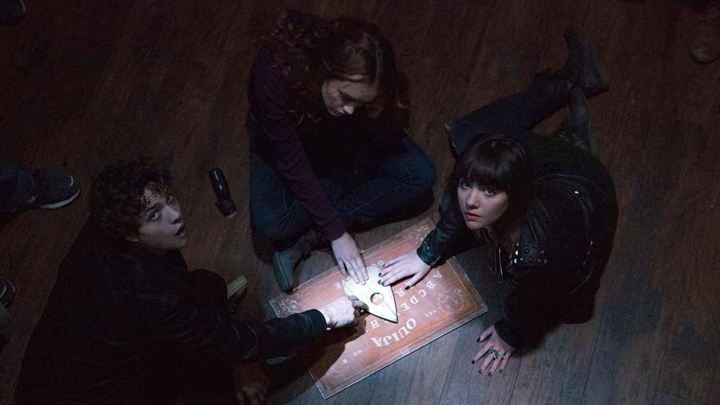 The horror movie "Ouija" stars actors Douglas Smith, from left, Ana Coto and Olivia Cooke.