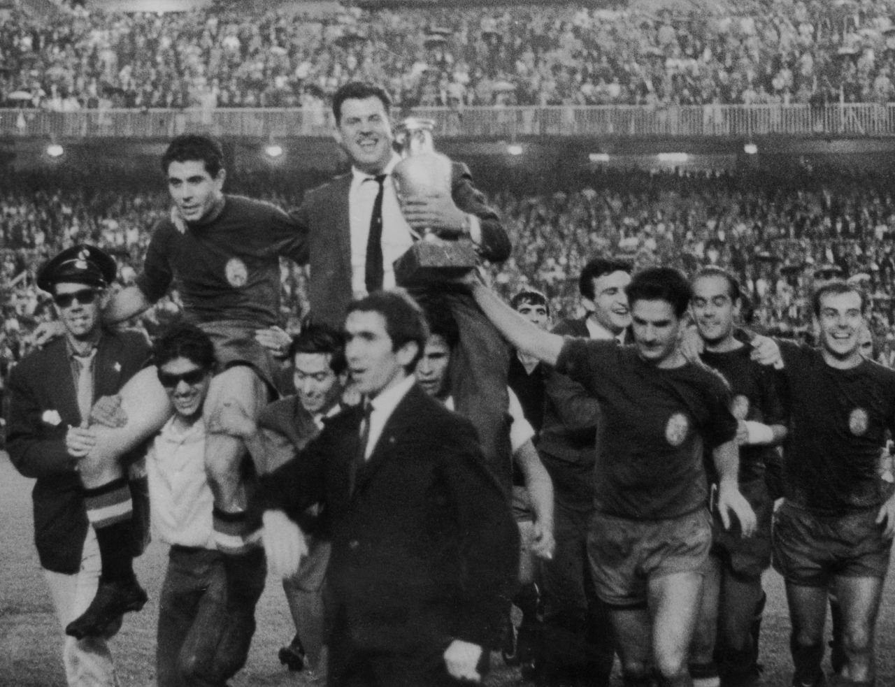 The Spanish football team bear their manager, Jose Villalonga, aloft to celebrate their victory in the 1964 European Nations Cup, when they beat the Soviet Union 2-1 at the Santiago Bernabeu.
