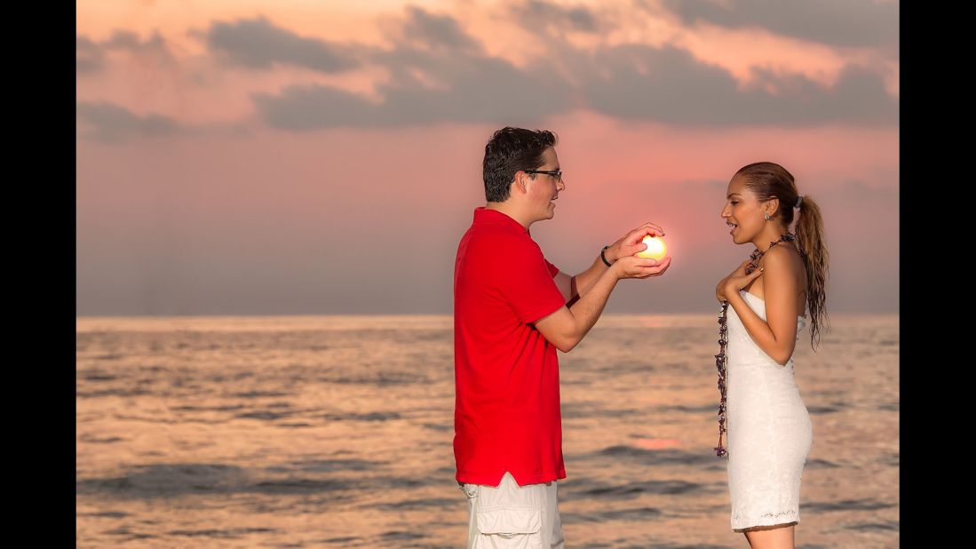 Wedding photographer Daniel Stoychev was inspired to try his hand at forced perspective during a few of his <a href="http://ireport.cnn.com/docs/DOC-1182497">engagement photo shoots</a> in Riviera Nayarit, Mexico. "I mean who would refuse such a gift, the sun! I find it romantic and the women loved it," he said.