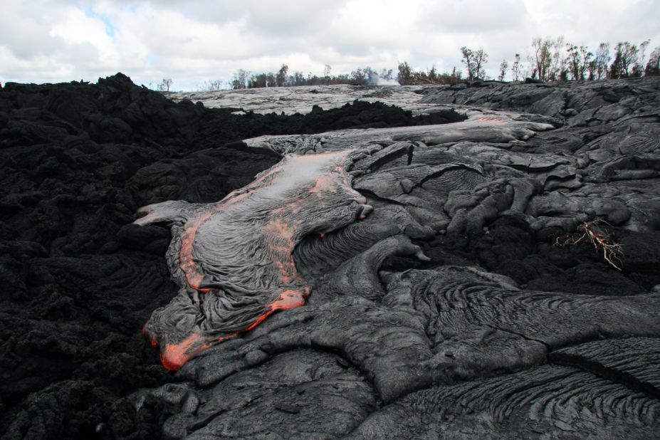 Lava flows from the Kilauea volcano in Pahoa, Hawaii, in October 2014. The flow picked up speed, prompting emergency officials to close part of the main road through town and tell residents to be prepared to evacuate.