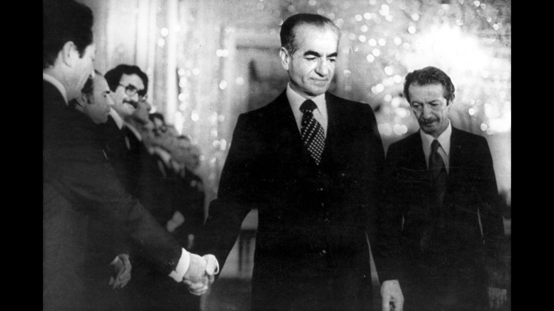 The Shah shakes hands with a minister of the new civilian government in Tehran on January 6, 1979. Ten days later, he fled the country and headed to Egypt.