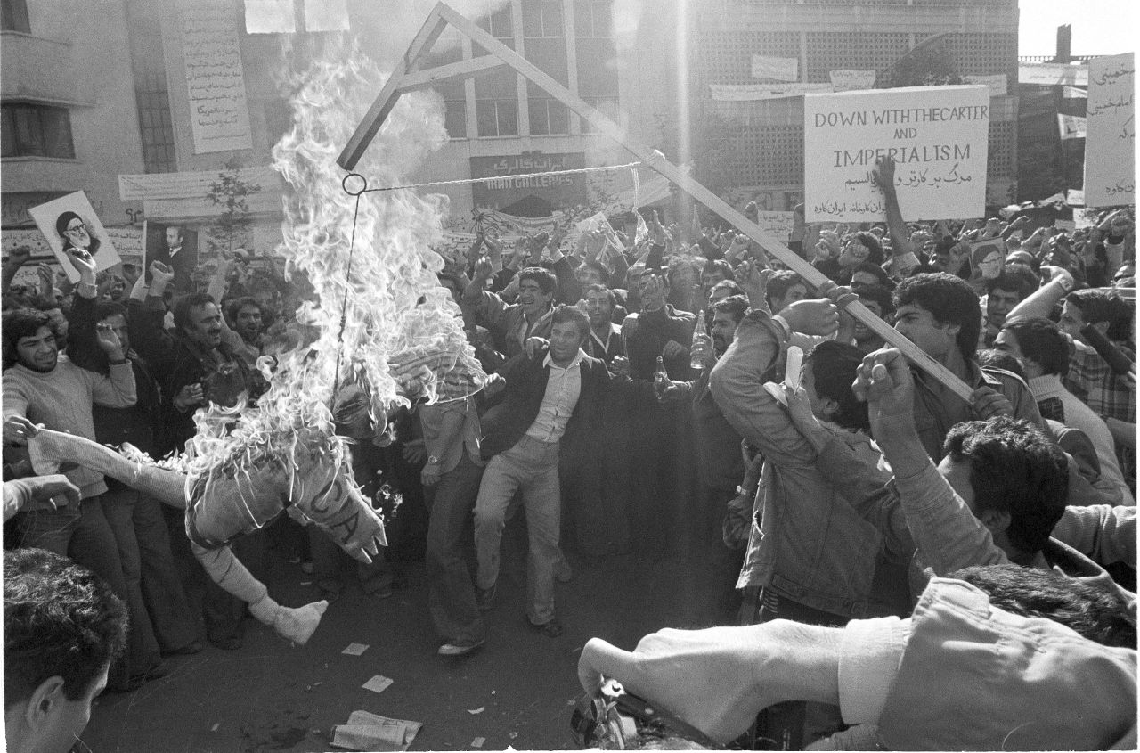 Demonstrators burn an effigy of Uncle Sam outside the U.S. Embassy in Tehran on November 13, 1979. They had gathered to show support for the Iranian militants who took over the embassy. The effigy was branded with "CIA" on its arm.