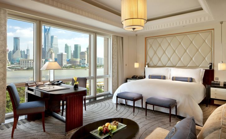 From its location on the historic Bund, the Peninsula Shanghai's rooms and rooftop bar offer views toward the city's Lujiazui skyscrapers.