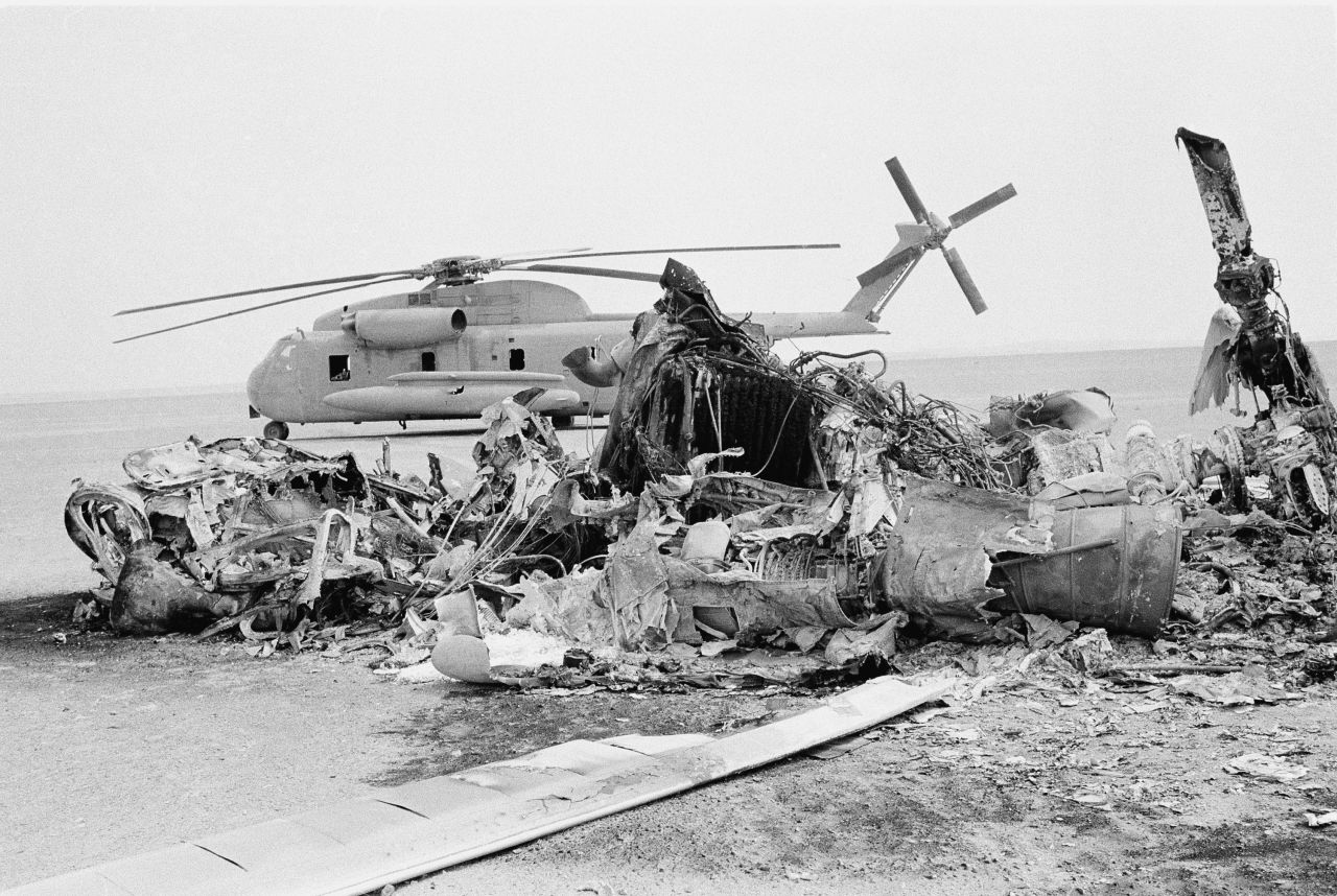 Remains of a burned-out American helicopter are seen in front of an abandoned chopper in the eastern desert of Iran in April 1980. Eight U.S. servicemen were killed when a helicopter and a transport plane collided during a failed attempt to rescue the hostages.