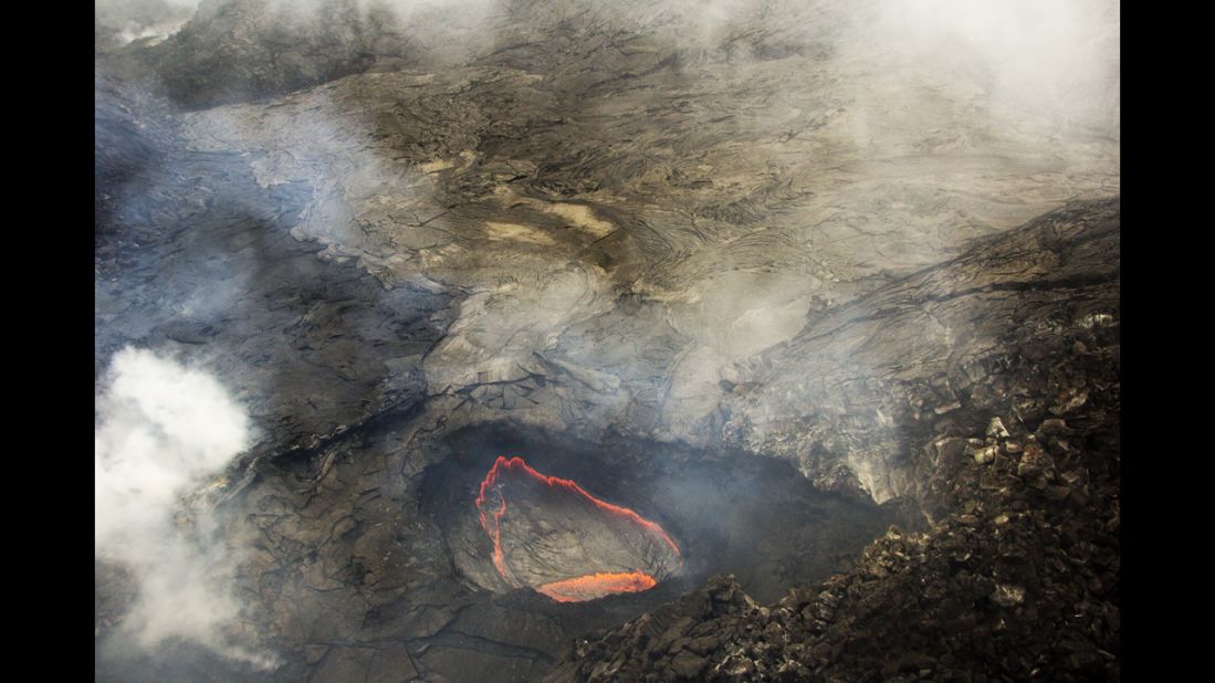 Pu'u O'o Crater, in the eastern rift zone of Kilauea, remains filled with thick fumes, but recent views with the naked eye and thermal camera confirm that little change has occurred in the crater over recent weeks. The fumes mask a handful of small, glowing openings on the crater floor.