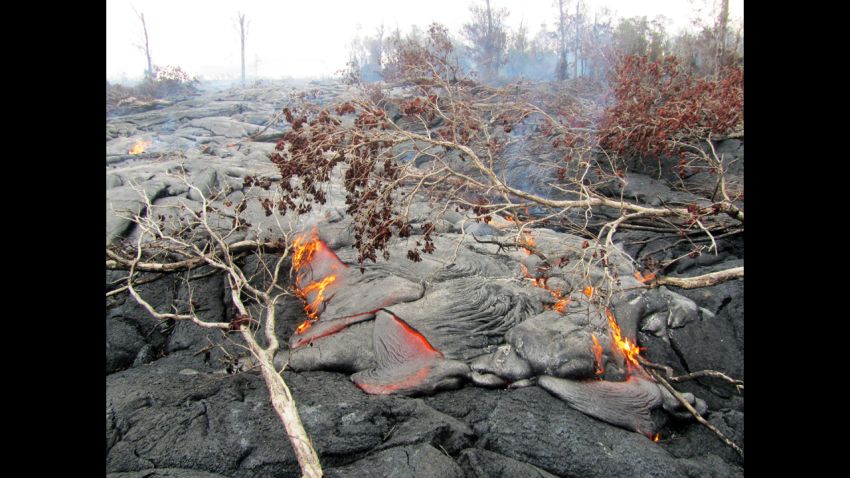September 15, 2014 — Kīlauea
A closer view of surface activity on the June 27th lava flow. This pāhoehoe flow consists of many small, scattered, slow-moving lobes burning vegetation.