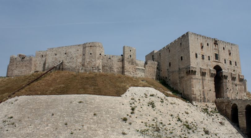 The fortress spans at least four millennia, from the days of Alexander the Great, through Roman, Mongol, and Ottoman rule. The site has barely changed since the 16th century and is one of Syria's most popular World Heritage sites. The citadel has been used as an army base in recent fighting and several of its historic buildings <a href="index.php?page=&url=http%3A%2F%2Fprojects.nytimes.com%2Fwatching-syrias-war%2Ffootage-shows-damage-to-aleppo-citadel" target="_blank" target="_blank">have been destroyed</a>.