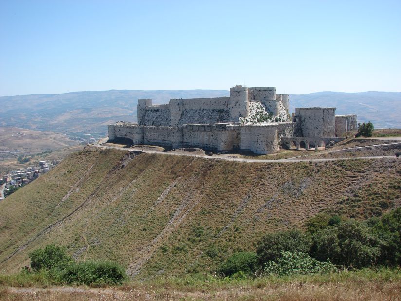 The Crusader castle from the 11th century survived centuries of battles and natural disasters, becoming a World Heritage site in 2006 along with the adjacent castle of Qal'at Salah El-Din. The walls were severely damaged by <a href="http://ghn.globalheritagefund.com/uploads/documents/document_2107.pdf" target="_blank" target="_blank">regime airstrikes and artillery in 2013</a>, and rebels took positions within it.