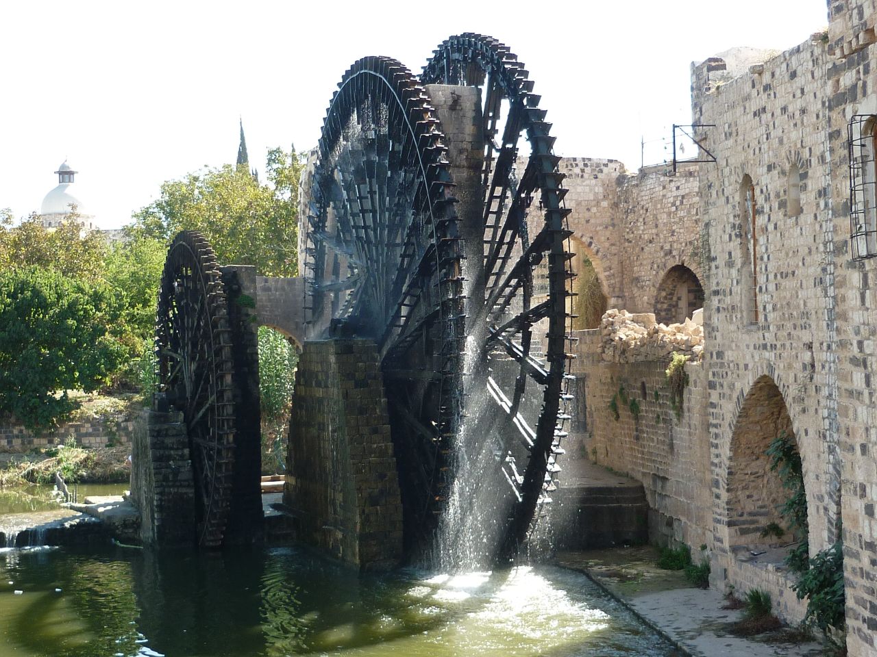These 20-meter wide water wheels were first documented in the 5th century, representing an ingenious early irrigation system. Seventeen of the wooden norias (a machine for lifting water into an aqueduct) survived to present day and became Hama's primary tourist attraction, noted for their groaning sounds as they turned. Heritage experts <a href="http://www.dgam.gov.sy/index.php?p=314&id=1374" target="_blank" target="_blank">documented several wheels</a> being burned by fighters in 2014.