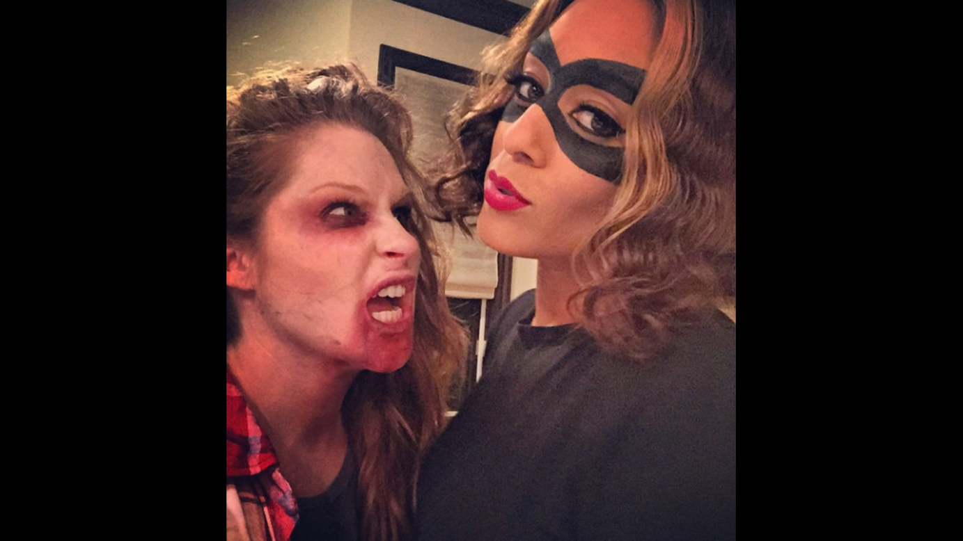Actress Tia Mowry, left, and makeup artist Julianne Kaye dress up on Sunday, October 26. "Zombies vs. cats," <a href="http://instagram.com/p/umvfXxJfjf/?modal=true" target="_blank" target="_blank">Mowry wrote</a> on her Instagram account.