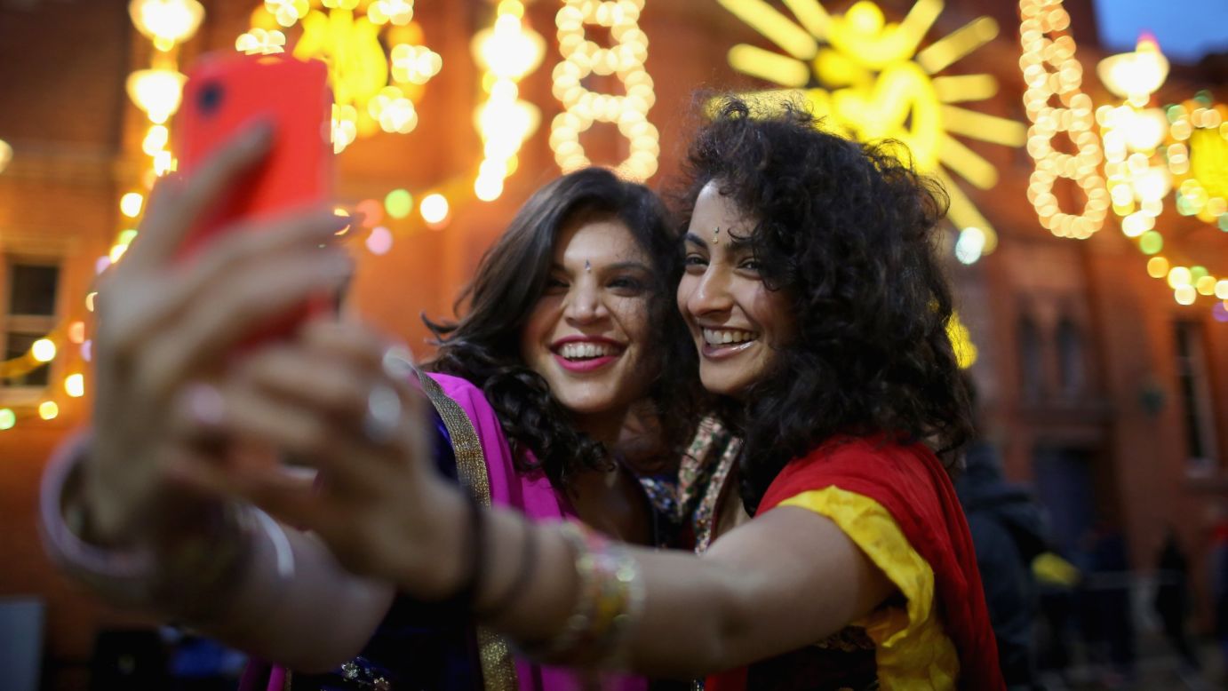 Aanka Batta, left, and her friend Kelly Vaduka take a selfie Thursday, October 23, as they celebrate the Hindu festival of Diwali in Leicester, England. Up to 35,000 people attended the Bandi Chhor Divas, commonly known as the Diwali festival of light, in the heart of Leicester's Asian community. It is one of the biggest Diwali celebrations outside of India.