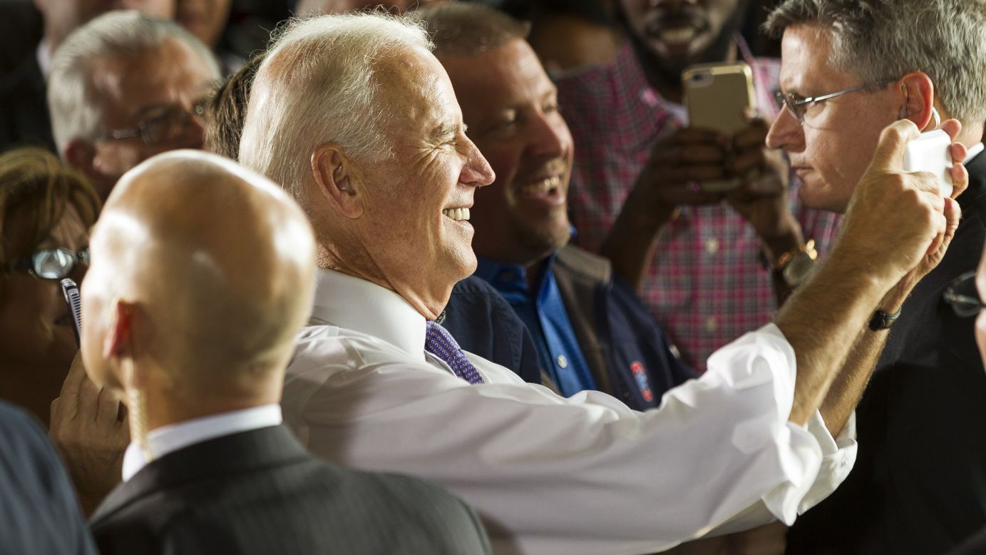 U.S. Vice President Joe Biden takes a selfie Monday, October 27, after a rally for U.S. Rep. Bruce Braley in Davenport, Iowa. Braley is running for the U.S. Senate seat being vacated by Tom Harkin.