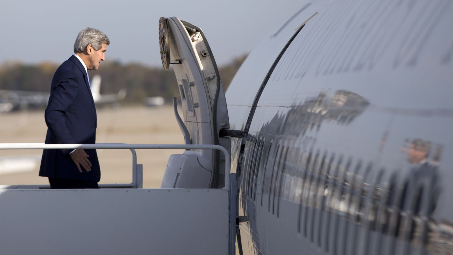 John Kerry boards his plane en route to Ottawa, Canada.