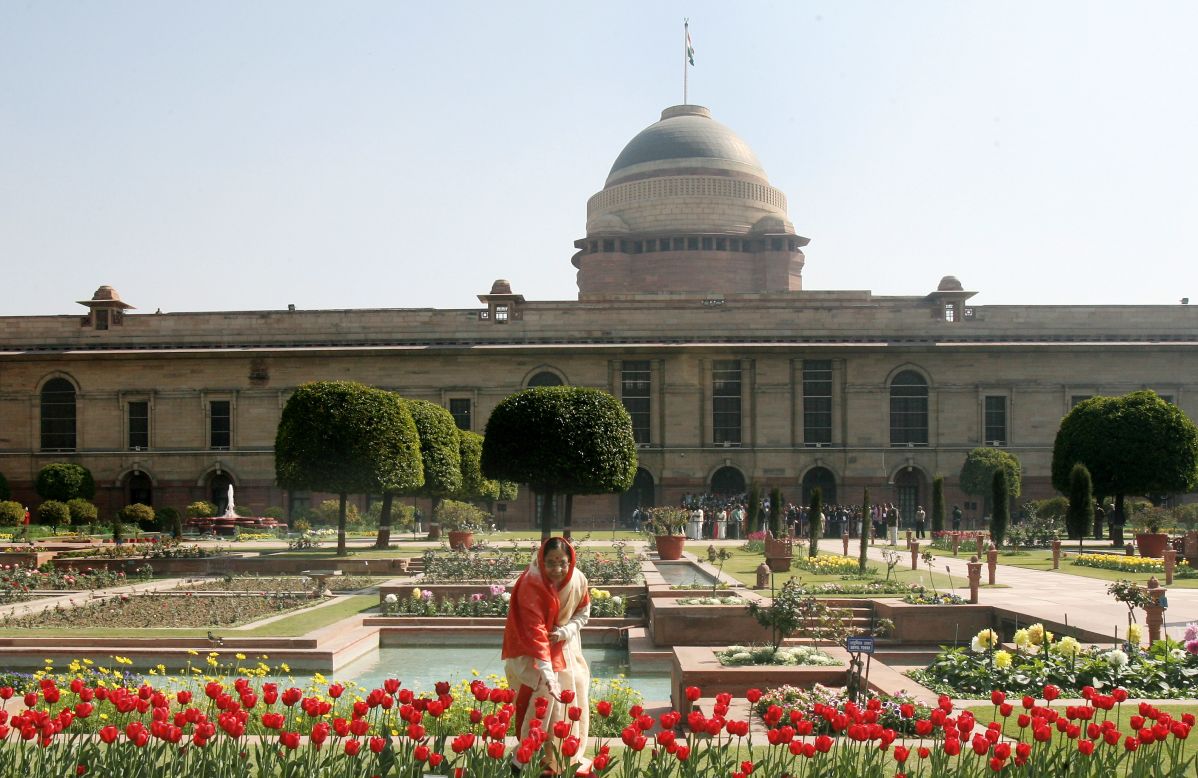 Former Indian President Pratibha Devisingh Patil touches a display of tulips in the Mughal Garden at the Rashtrapati Bhawan (the presidential palace) in New Delhi on February 14, 2008. 