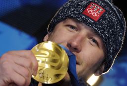 Bode Miller poses with Olympic gold in 2010.