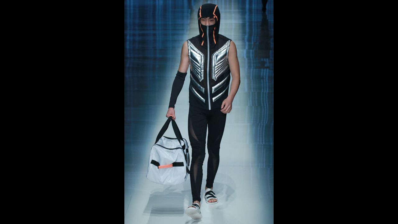 The QIAODAN Yin Peng Sports Wear Collection show included fashions and masks for both men and women.