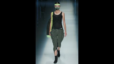 A model sports a face mask for the QIAODAN Yin Peng Sports Wear Collection.