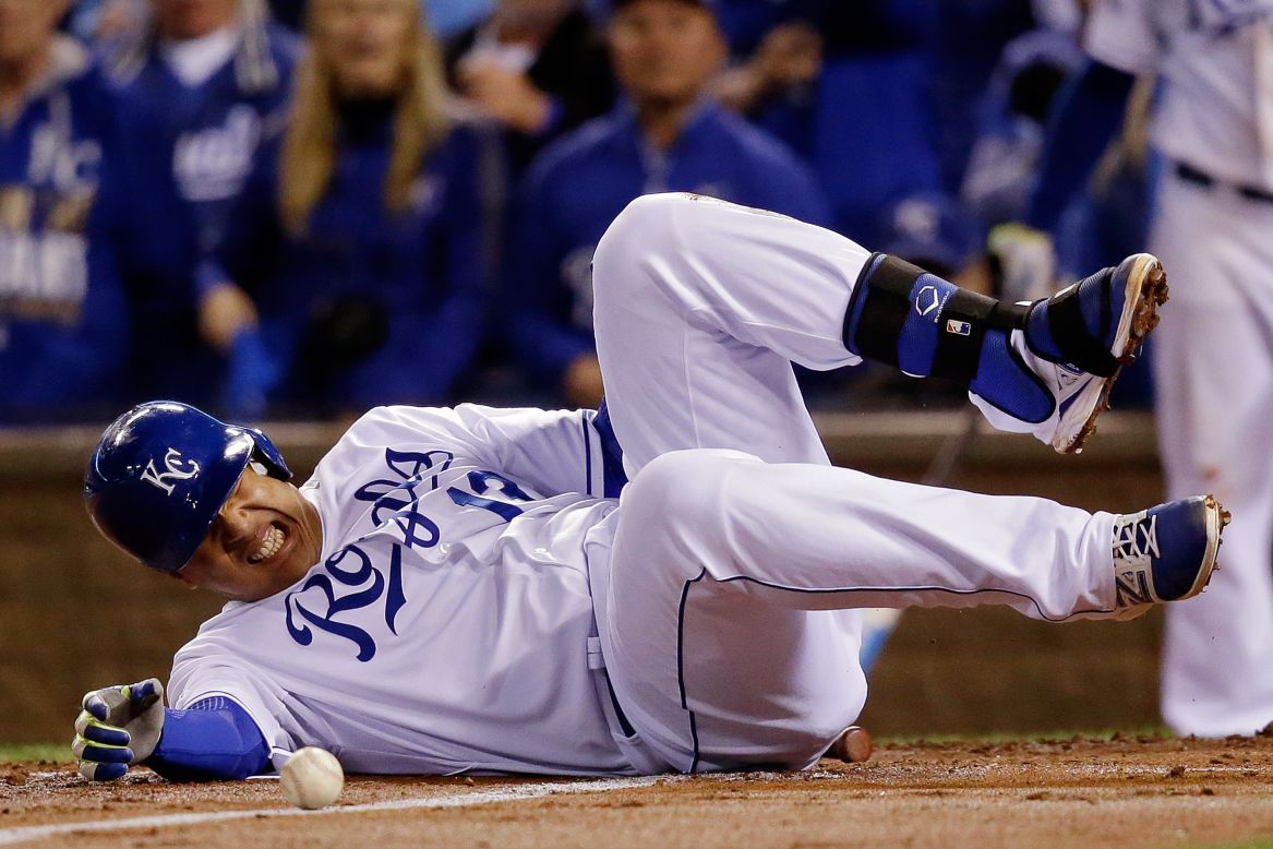 Kansas City Royals catcher Salvador Perez grimaces after being hit by a pitch in the second inning of Game 7 of the 2014 World Series at Kauffman Stadium on October 29 in Kansas City, Missouri. 